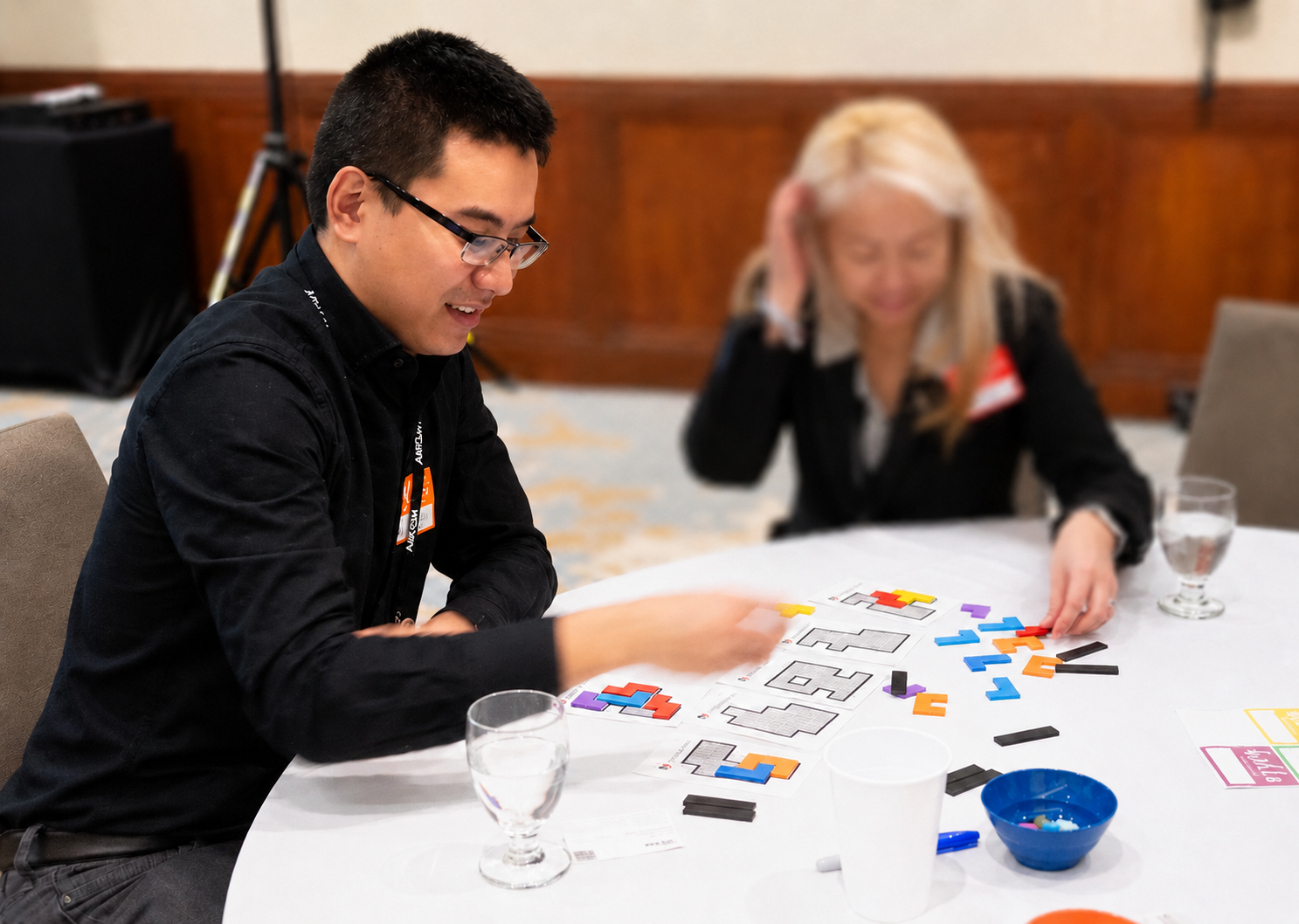 Luke Li working at a table during a collaborative workshop.